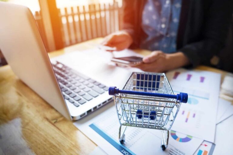 cropped-image-woman-inputting-card-information-key-phone-laptop-while-shopping-online-2-scaled-1